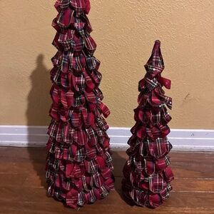 Christmas tree decorated with red and black plaid fabric or ribbon.